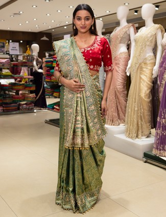 Magnificent green saree with red blouse