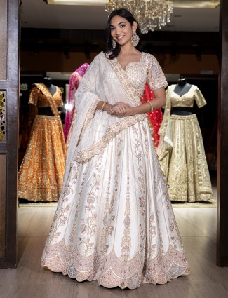 Cream silk lehenga choli with rich embellishment for women