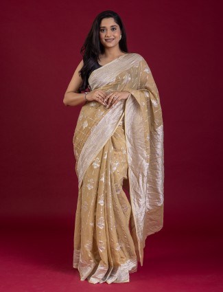 Beige tissue silk saree with zari work